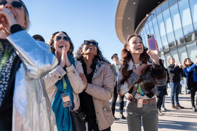 Family members watch a Virgin Galactic flight at Spaceport America