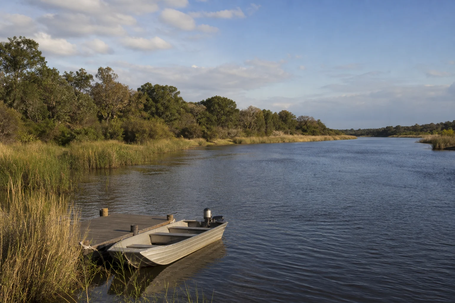 River frontage and small jetty in Botswana's Linyanti landscape