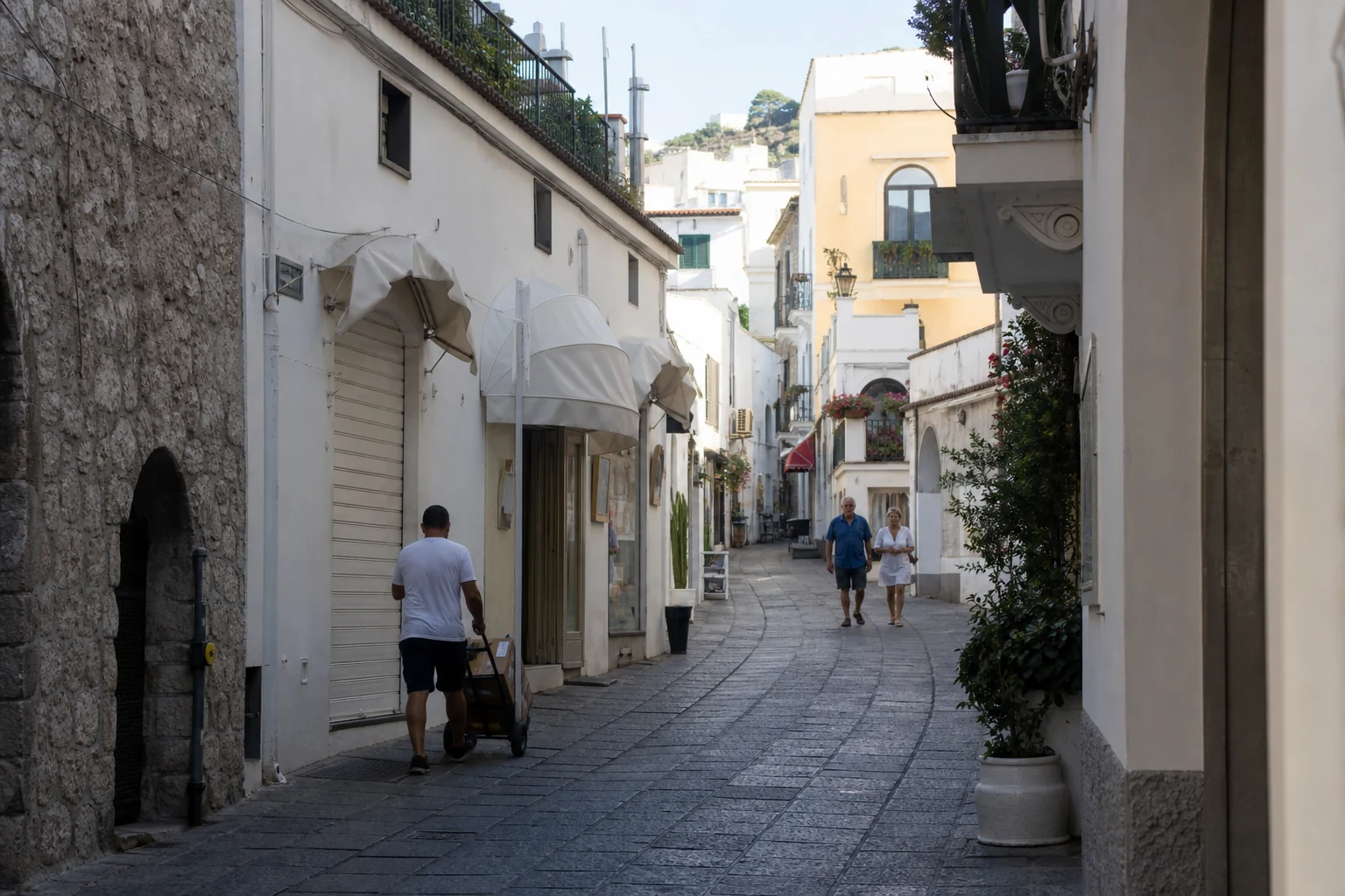 Capri town early in the morning with residents and a delivery