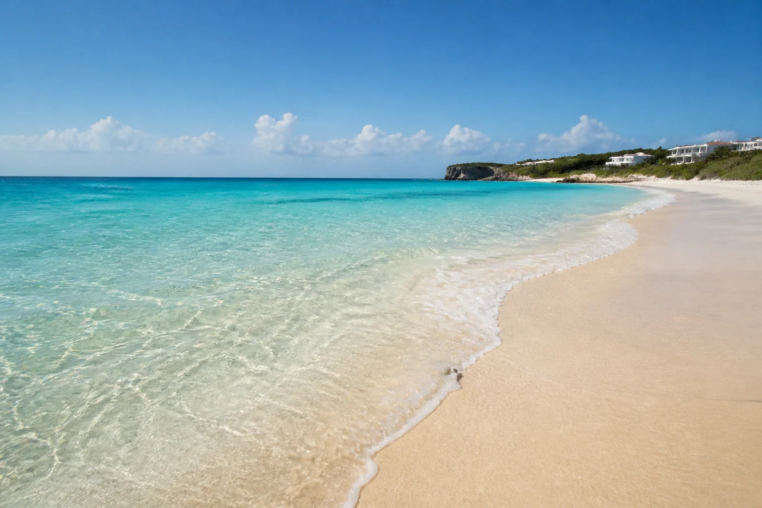 Pale sand and shallow-looking turquoise water at Shoal Bay, Anguilla