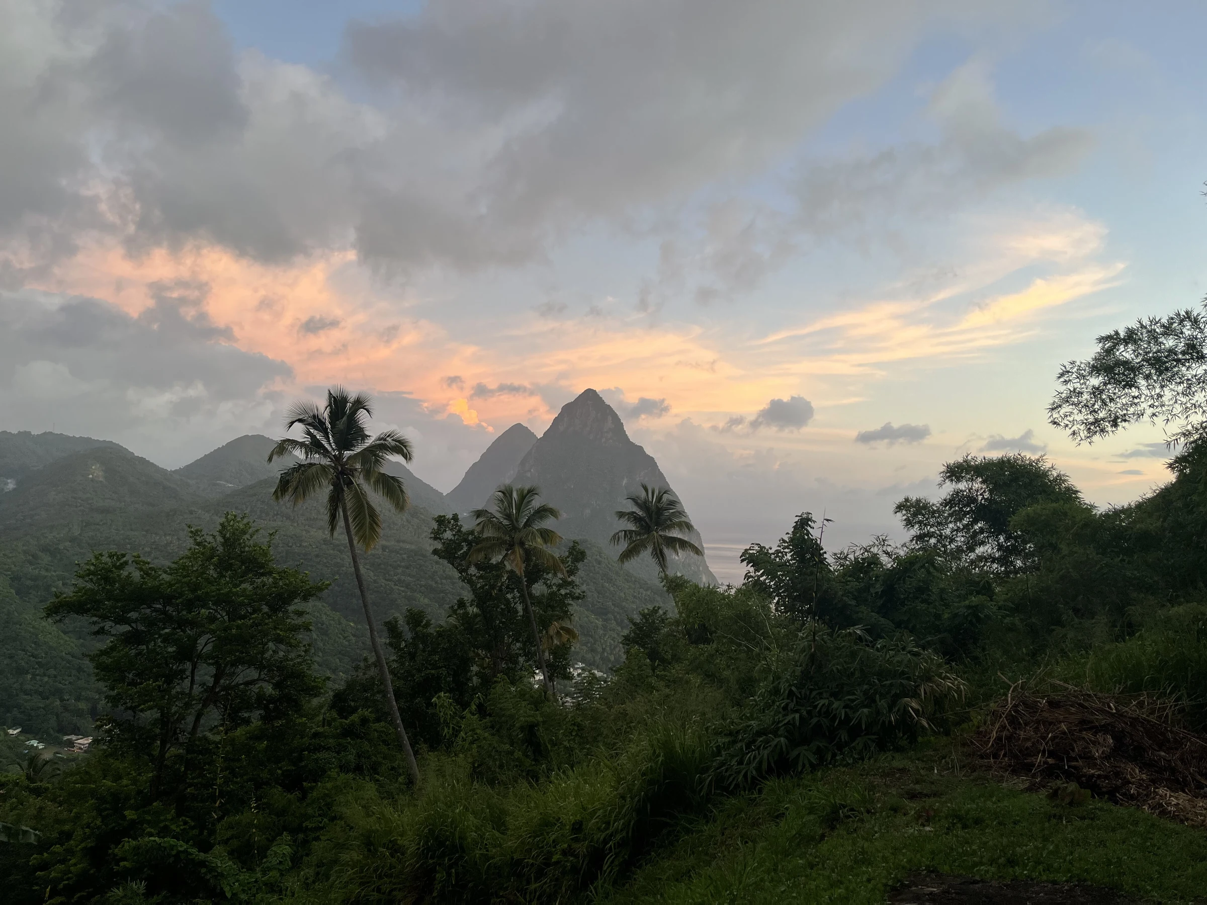 Petit Piton and Gros Piton above the green Soufrière landscape in Saint Lucia