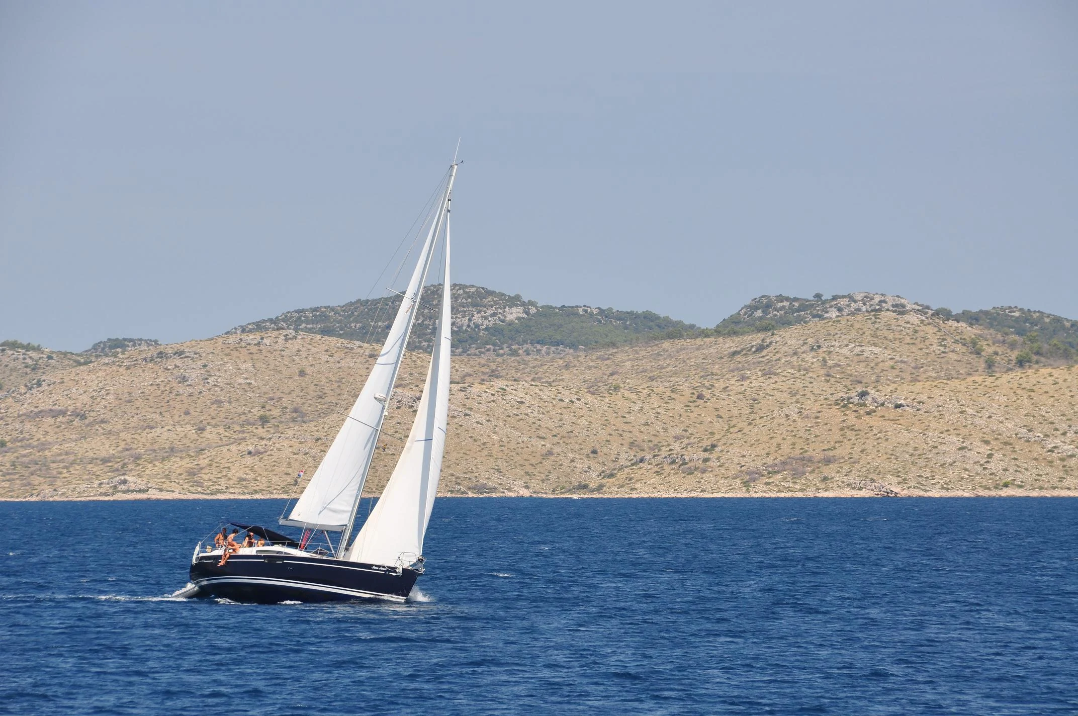 Sailboat in Telašćica Bay sailing towards the Kornati islands