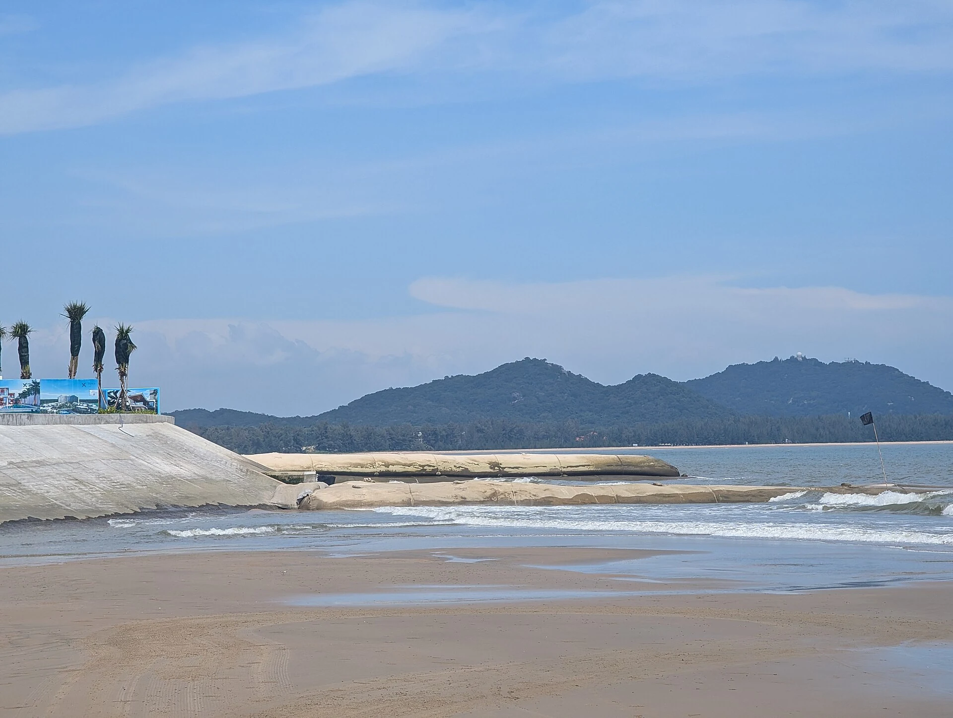 Real resort beach at Ho Tram with concrete barriers across an access point