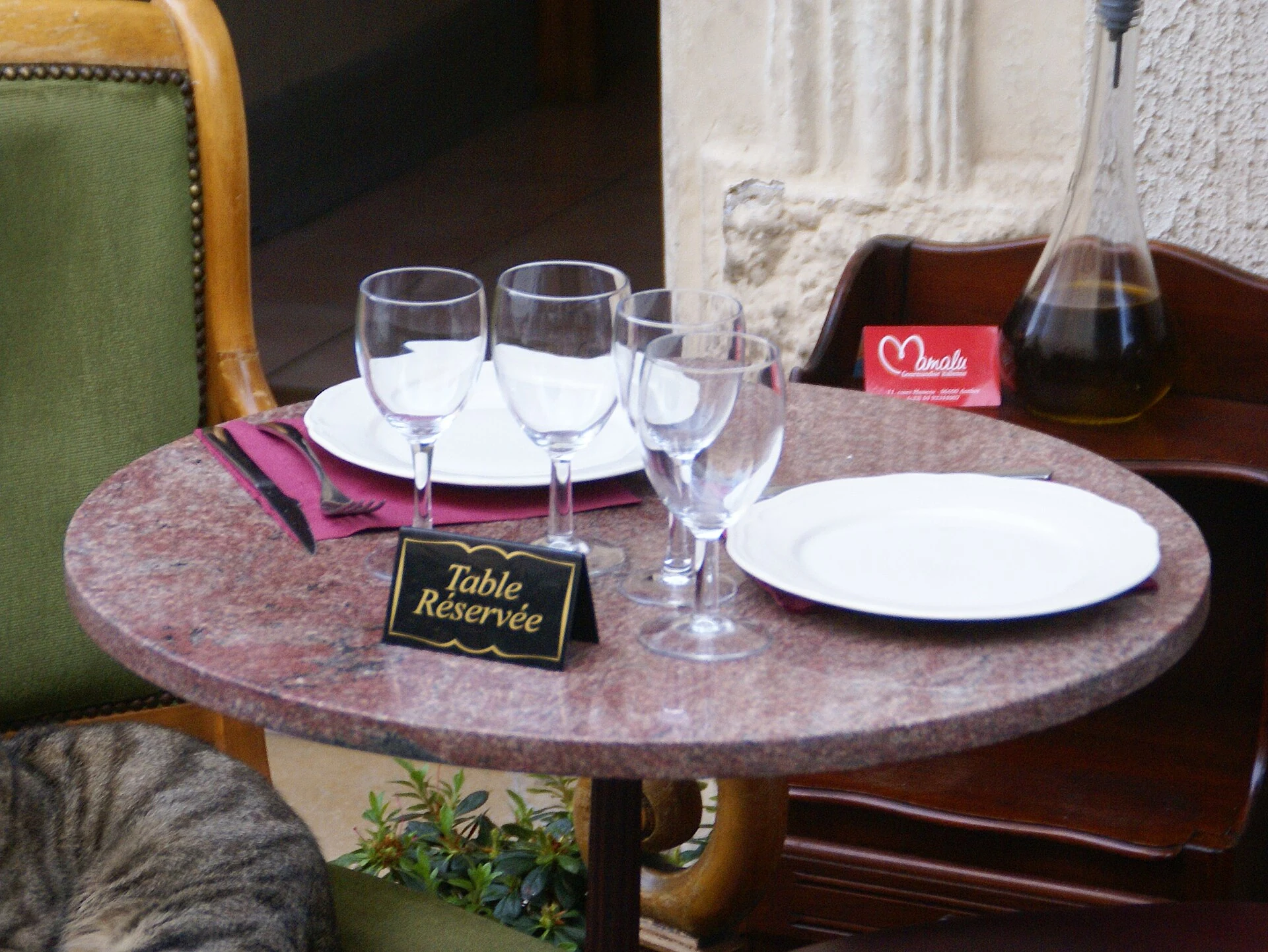 Set restaurant table with a French reserved sign