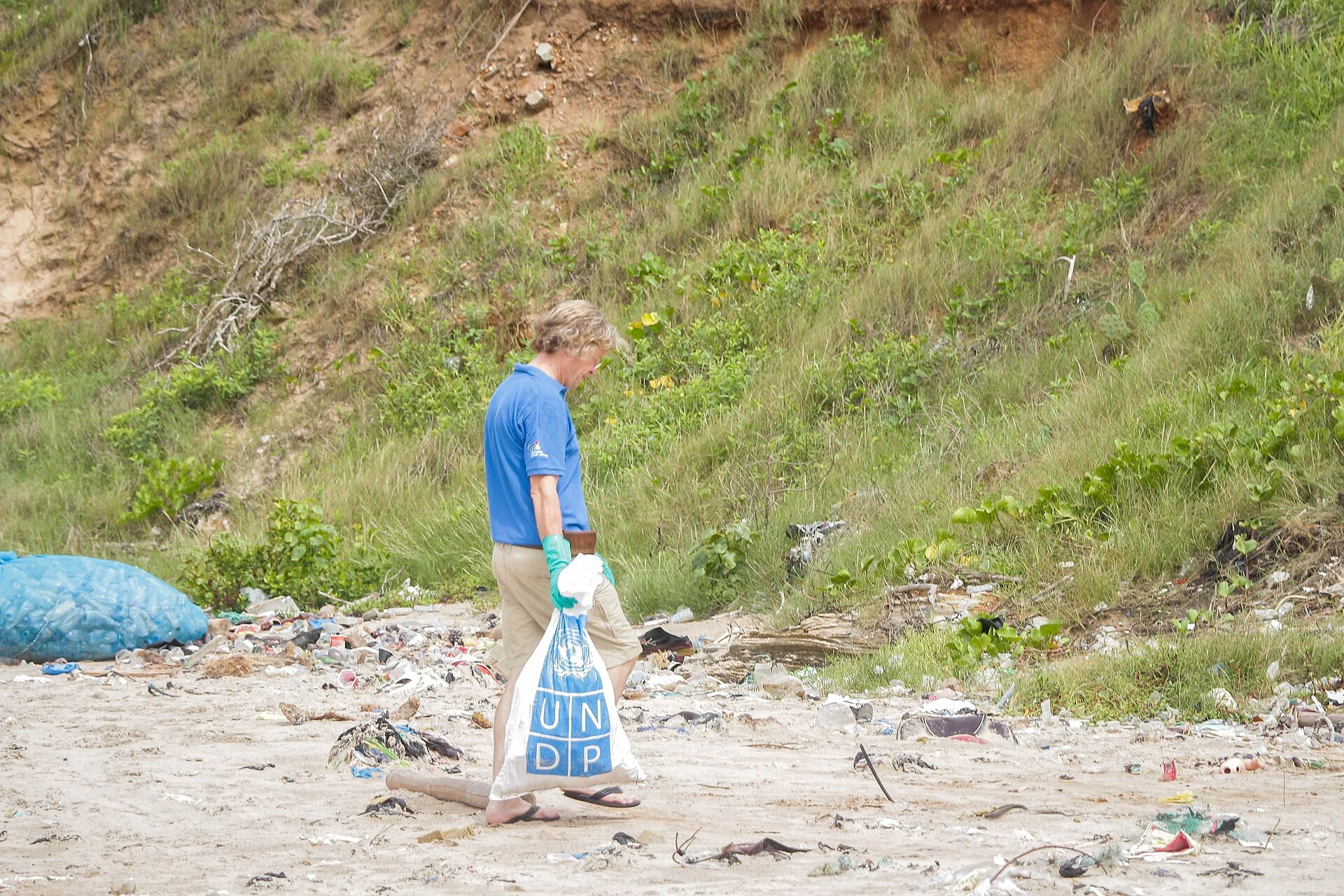 Real beach cleanup with collected plastic bottles in Ghana