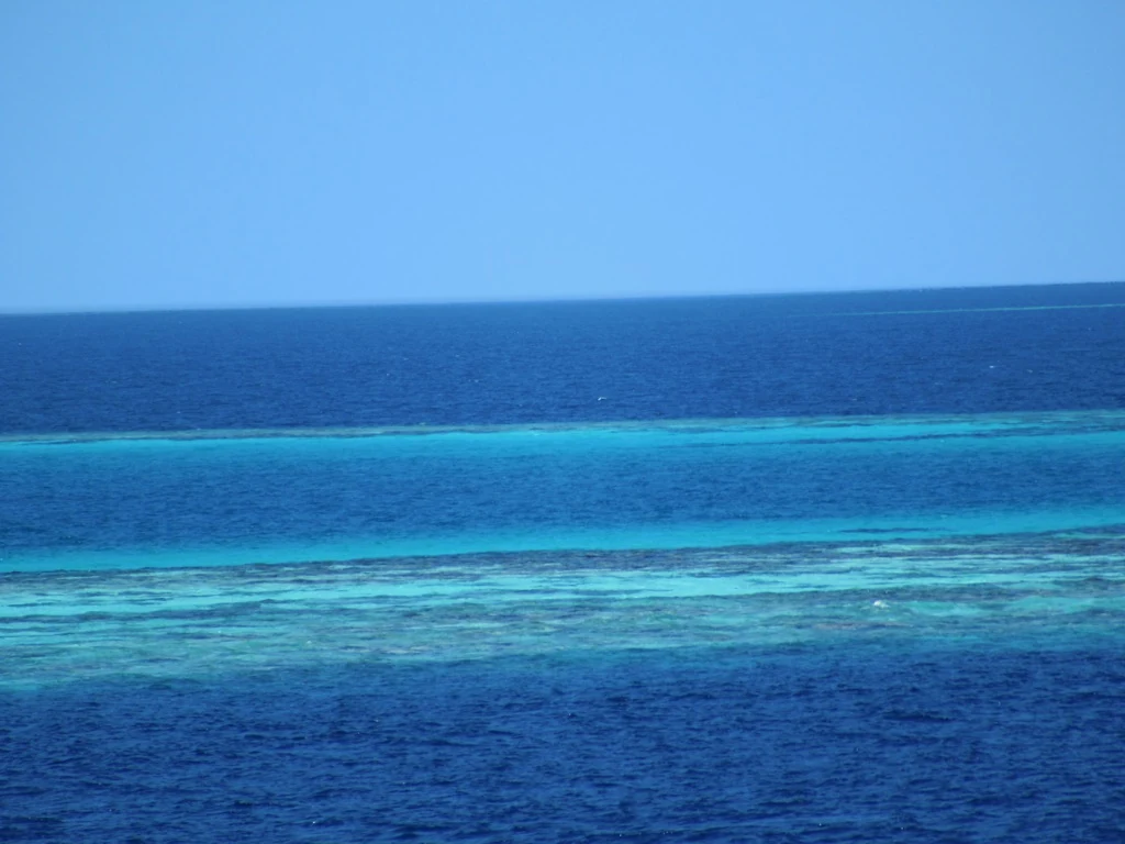 Bands of colour across a lagoon reef in the Maldives’ Meemu Atoll