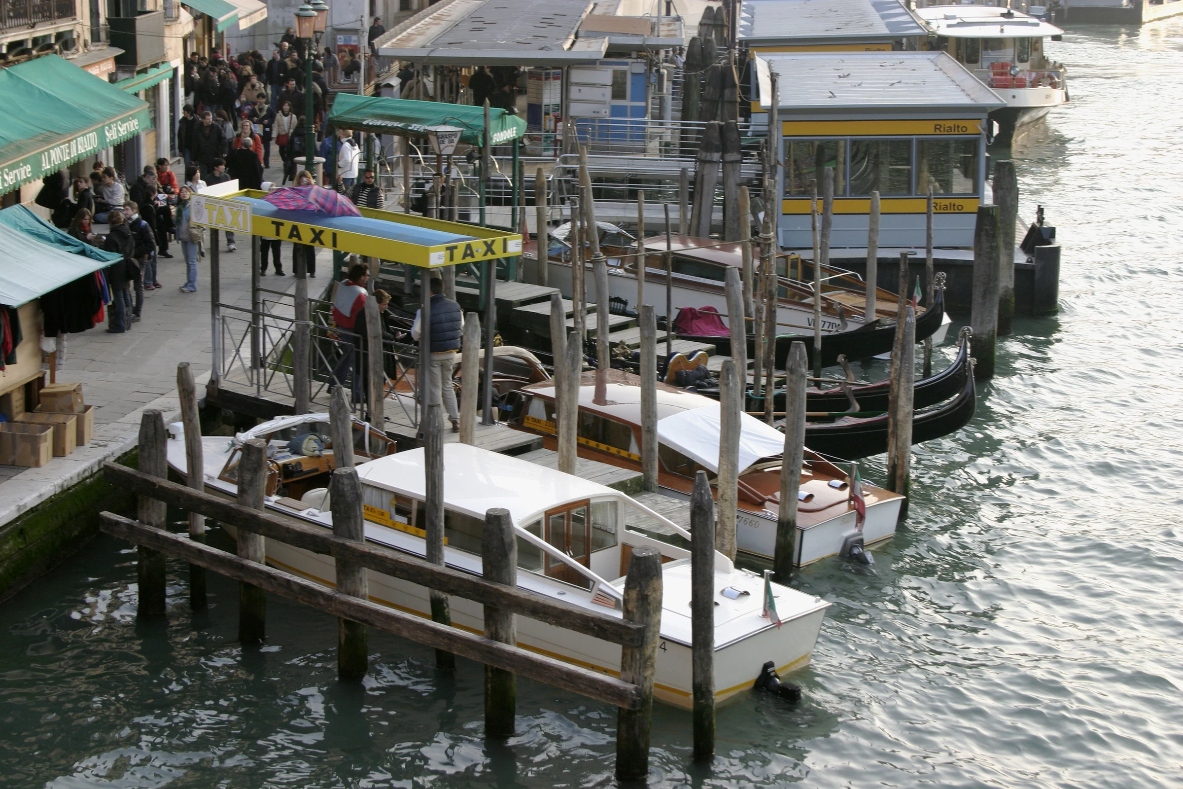 Water taxis, gondolas and landing stages at Rialto in Venice