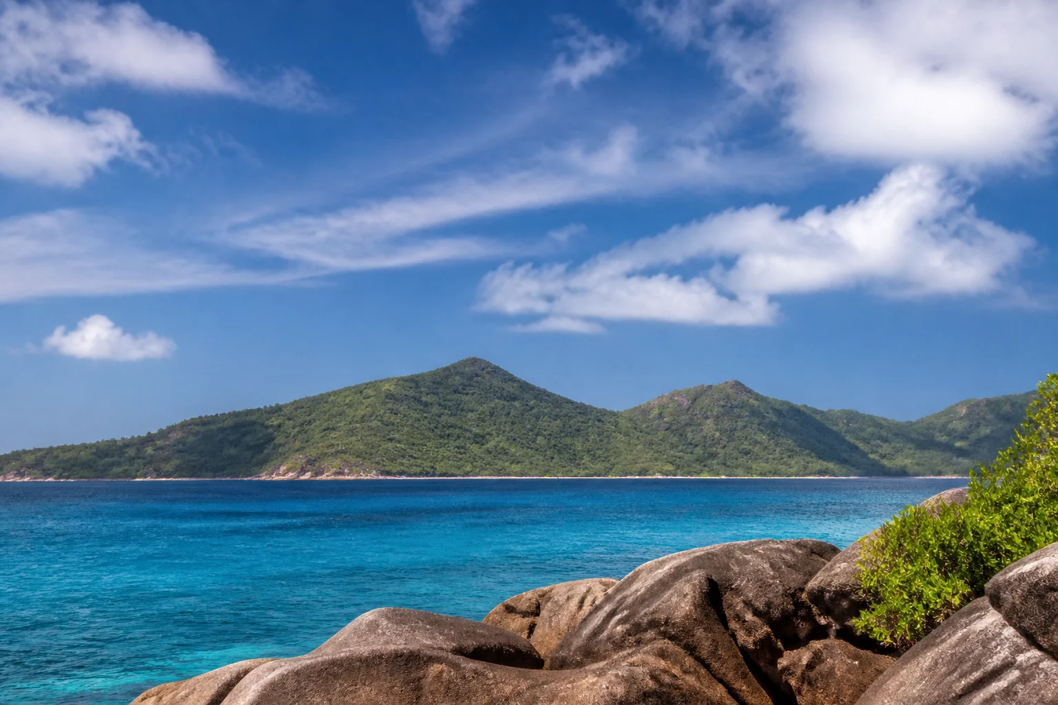 Praslin seen across the sea from La Digue in Seychelles