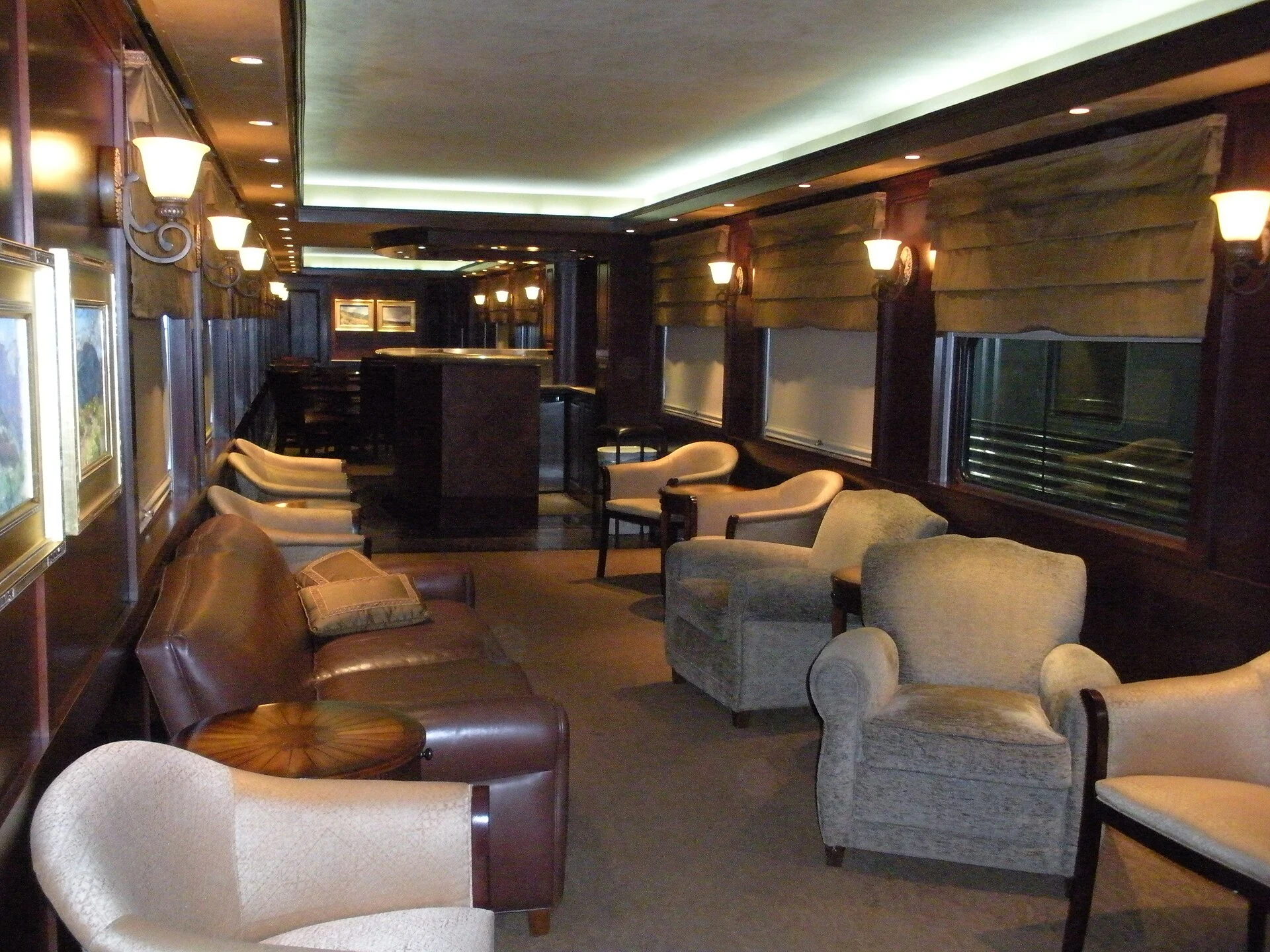 Real Mountain View railway lounge with armchairs, sofa, tables and bar