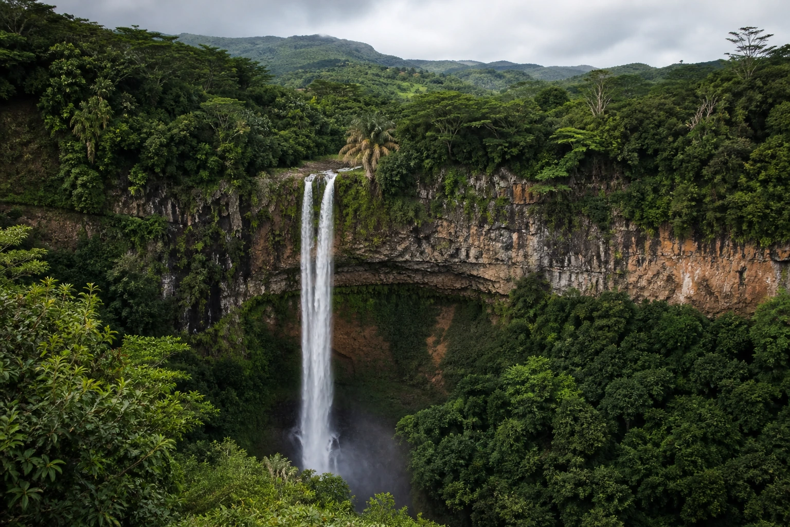 Real Chamarel Falls surrounded by dense tropical vegetation