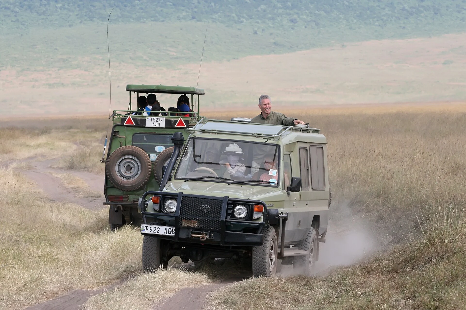 Real safari vehicles carrying guests in Ngorongoro Crater