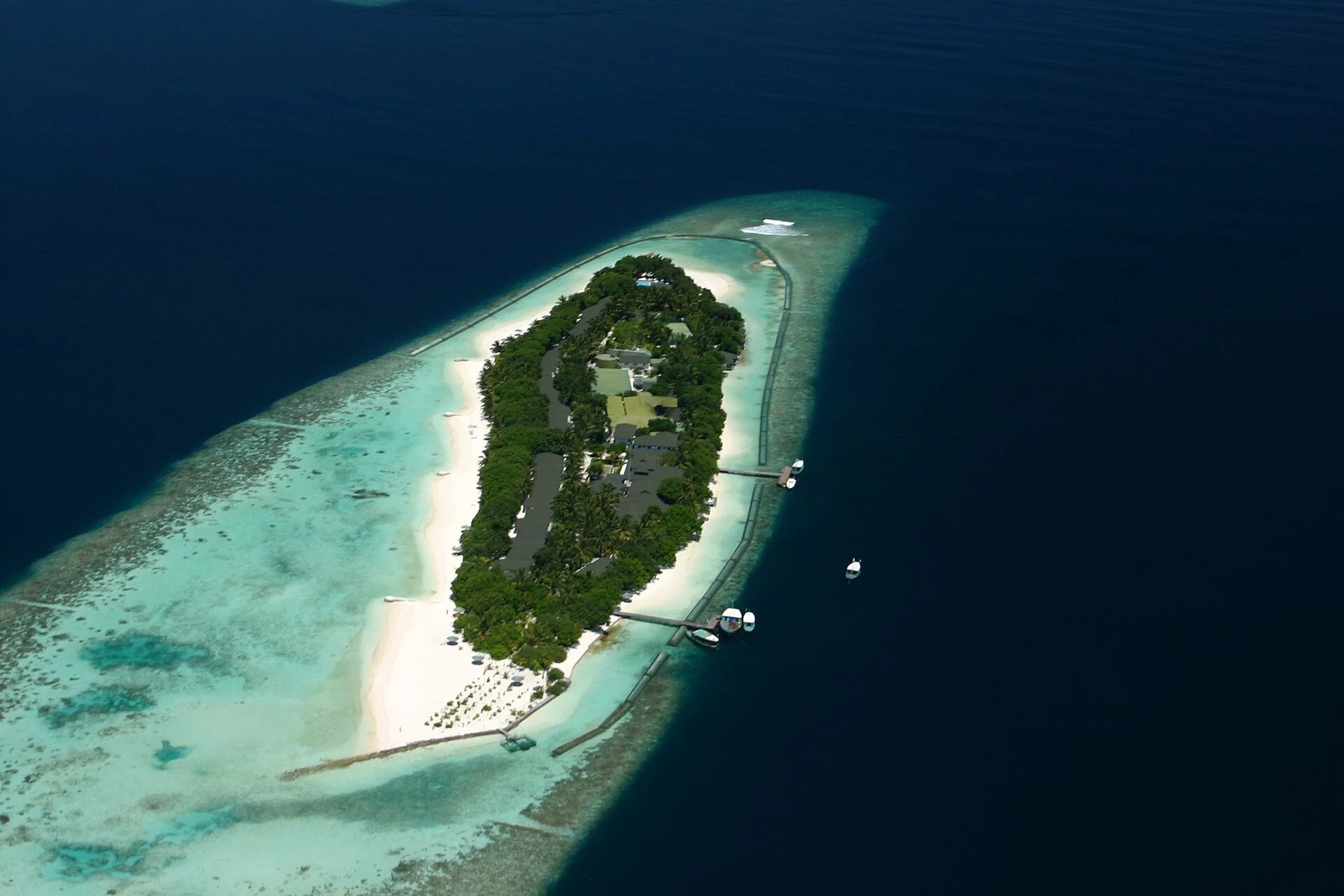 Real aerial view of a densely developed resort island in the Maldives